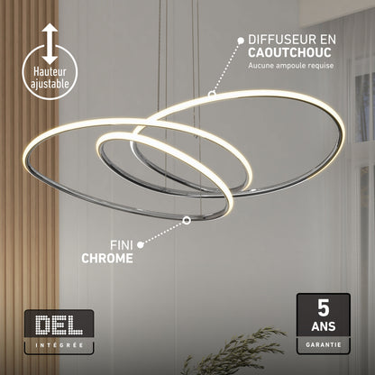Artika Swirl Butterfly LED pendant light, 3 CCT, shown in bright room with plant and large curtains.