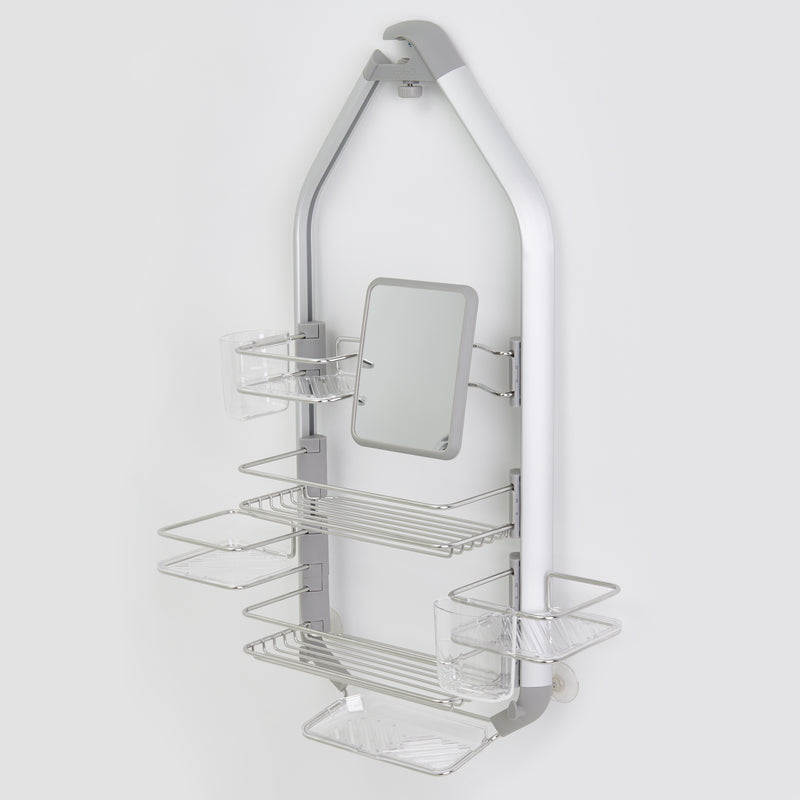 The Artika O2 hanging Shower Caddy features multiple wire shelves, clear plastic cups, and a small central mirror, all in a sleek silver design against a plain light background.