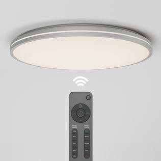 The Artika Athos 21 in. LED flush mount light features a modern round design and emits a soft white glow. It includes a remote for wireless control of brightness and color temperature settings.