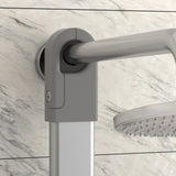 Close-up of a modern adjustable shower head holder mounted on a marble-patterned bathroom wall, showing the metallic shower arm and part of the round shower head.