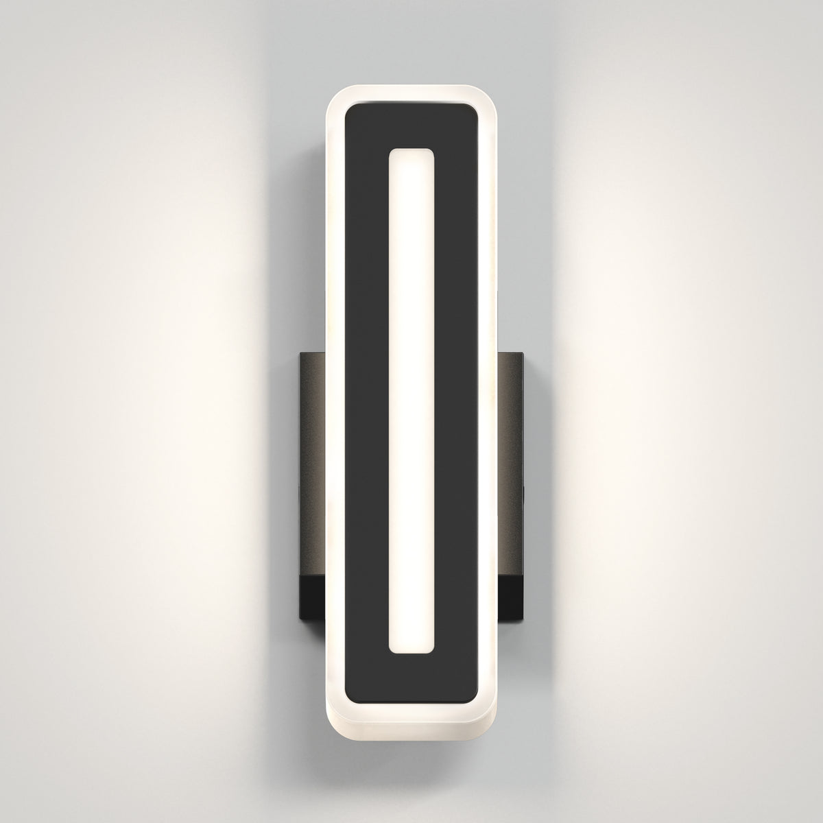 The Artika Evasion modern indoor-outdoor LED wall light 3 CCT features a rectangular black frame and vertical white illuminated center, mounted on a light gray wall to cast soft, dual-sided light.