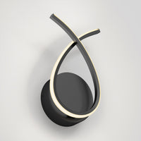 The Artika Gamma modern LED wall sconce 5 CCT features a circular black base and two intertwined curved light strips, offering a minimalist, sculptural design with adjustable warm illumination.
