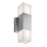 A modern wall sconce with a brushed metal center and frosted rectangular glass shades on both ends, emitting light upwards and downwards.