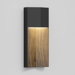 The Howel modern LED indoor-outdoor wall light 5 CCT by Artika features a matte black frame and wooden center panel, casting warm downlight and shown mounted on a light gray wall.