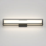 A modern, rectangular wall-mounted light fixture with a black frame and a horizontal frosted glass diffuser, emitting a soft, even glow against a white wall.