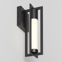 The Walt indoor-outdoor LED wall light by Artika features a matte black rectangular frame with a vertically mounted cylindrical frosted bulb, set on a square black wall plate against a light gray background.
