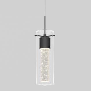 The Artika Essence LED pendant light features a cylindrical glass shade, black metal fixture, and a bubble-filled illuminated inner cylinder, suspended by a slim black cord against a plain gray background.