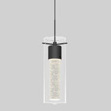 A modern pendant light with a cylindrical glass shade and a black metal fixture, featuring an illuminated inner tube with bubble-like details, suspended from a thin black cord against a plain gray background.