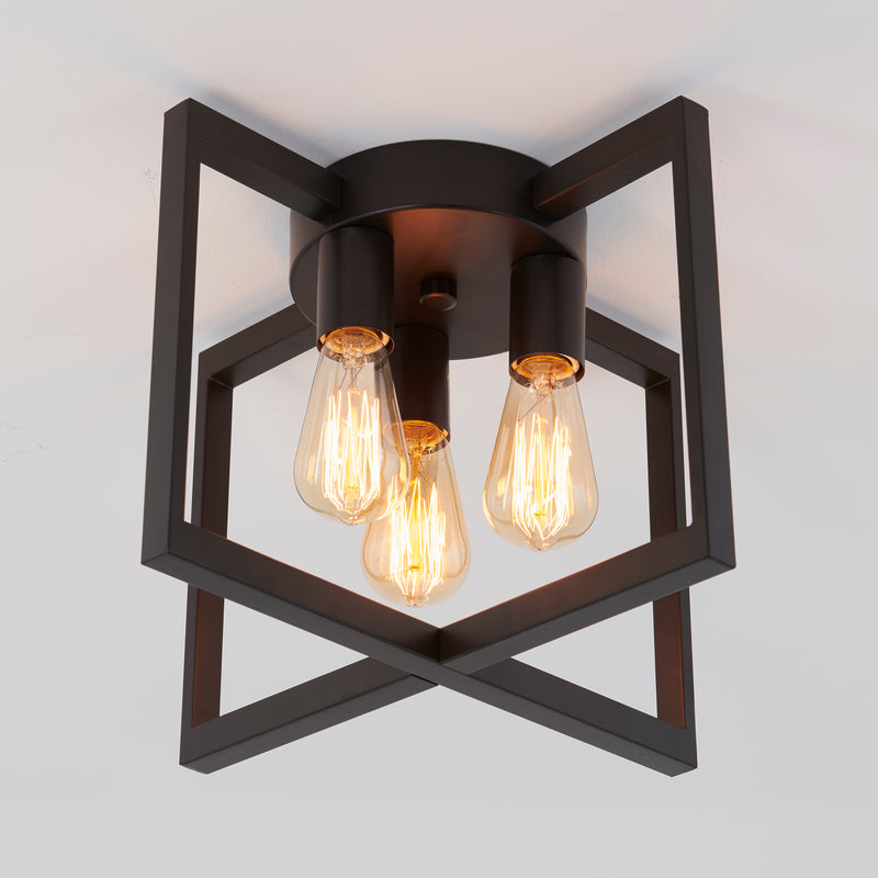 Artika Yale 3-light 15 in. flush mount ceiling light with black geometric frame and exposed bulbs on white ceiling.