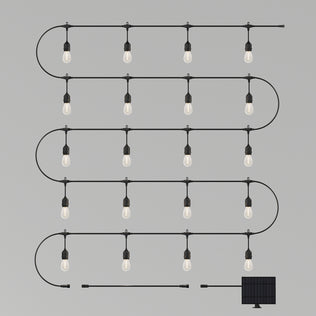 The Artika Blaze 20 LED Outdoor Solar String Lights feature five rows of bulbs in an S-shape, connected by a black cord and powered by a small rectangular solar panel at the bottom right, set against a plain light gray background.