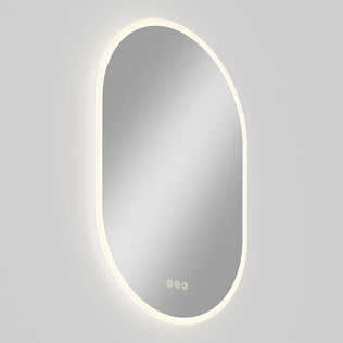 Artika Clara LED Mirror Oval 30x20 in. with defogger and 3 touch buttons, mounted on a light gray wall.