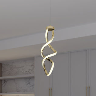 The Artika Mini Swirl LED pendant light, featuring a twisted ribbon-like design in gold, hangs from the ceiling of a minimalist room with light gray cabinets and marble-patterned walls.