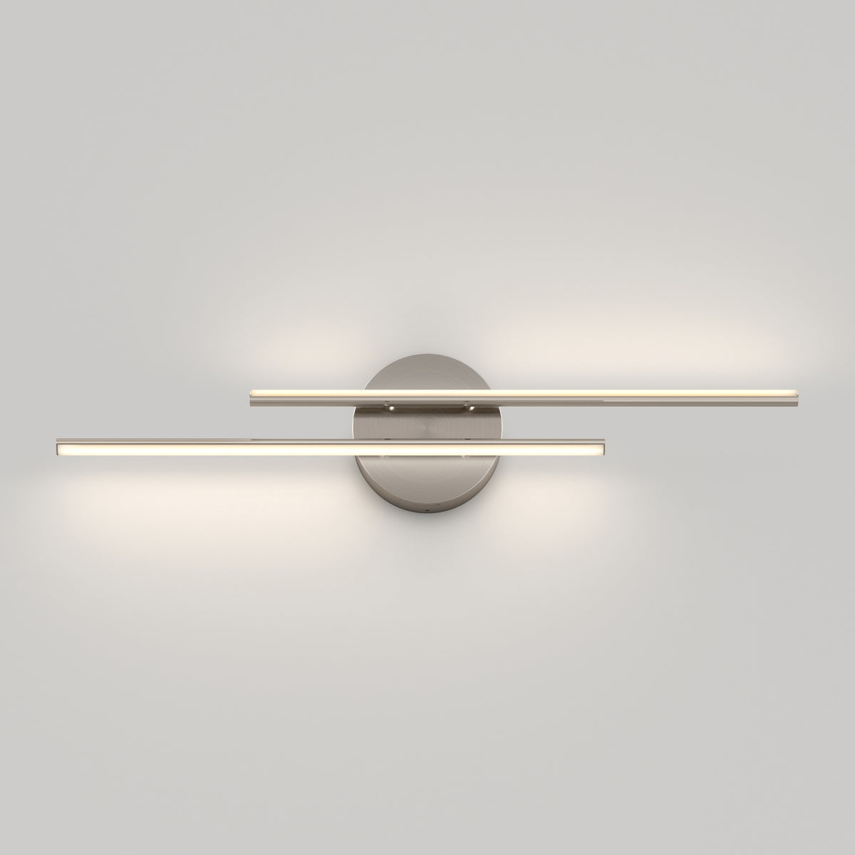 A modern wall-mounted light fixture with two horizontal, parallel LED bars extending from a round metallic base, casting soft light on a plain white wall.