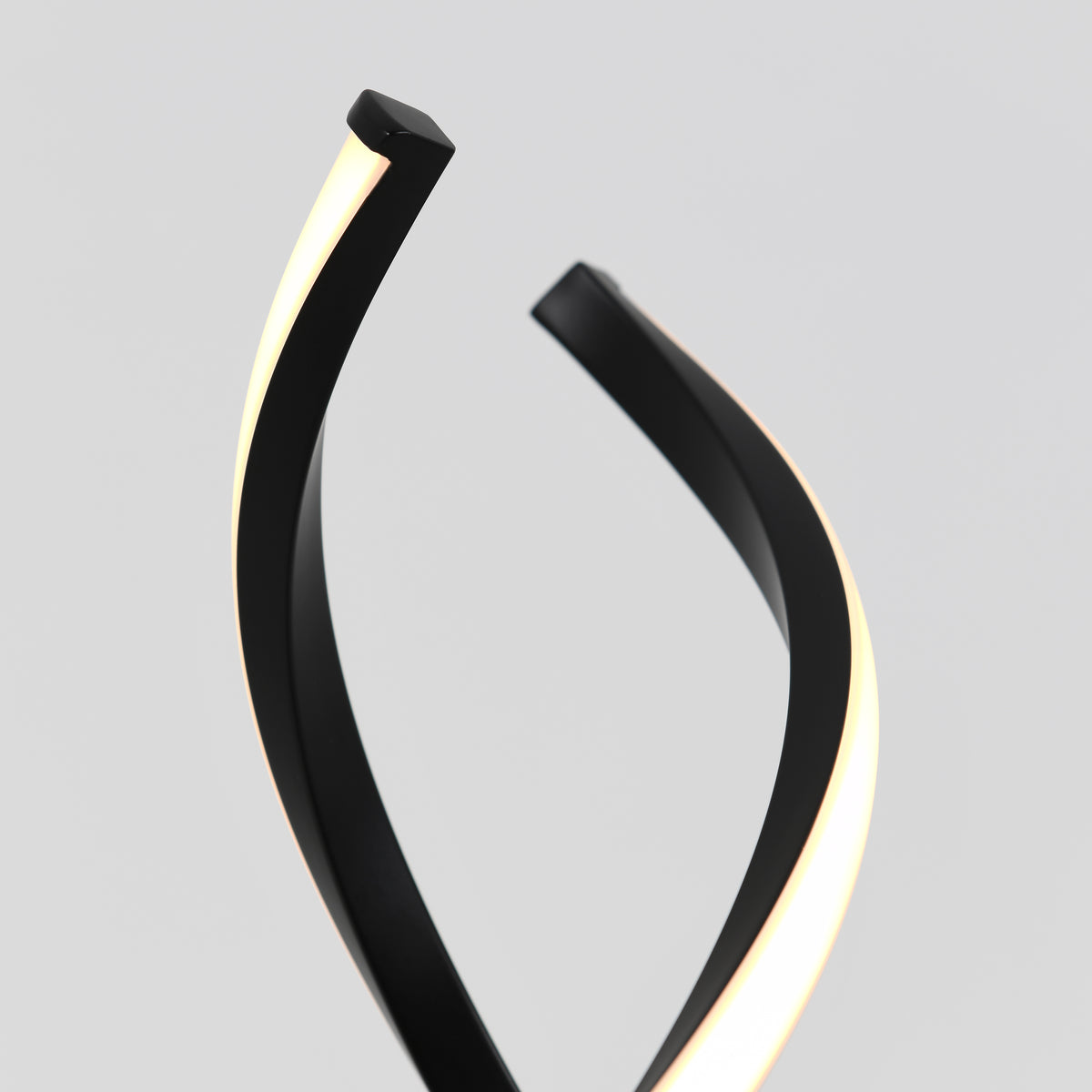 A modern lamp with two black curved arms, each featuring a strip of white LED light, set against a plain light gray background.