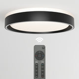 A modern, round, black and white ceiling light with a remote control below it, featuring various buttons for adjusting brightness, color, and settings. A Wi-Fi symbol indicates wireless control capability.