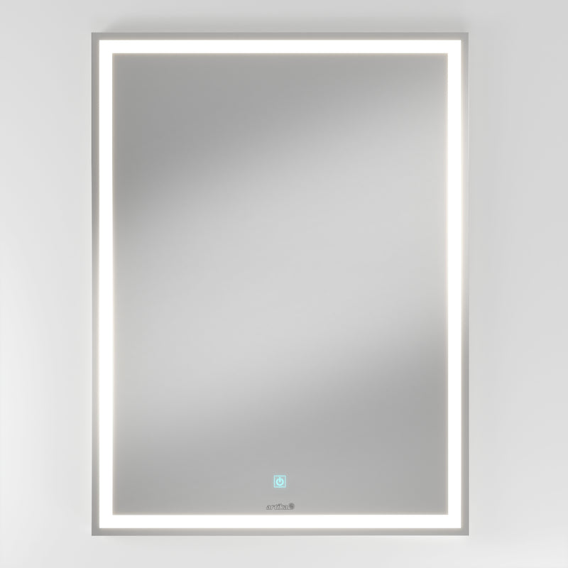 The Artika Emeraude dimmable LED mirror 3 CCT is a rectangular, wall-mounted mirror with an illuminated LED border and a circular touch button at the bottom center, shown against a plain white background.
