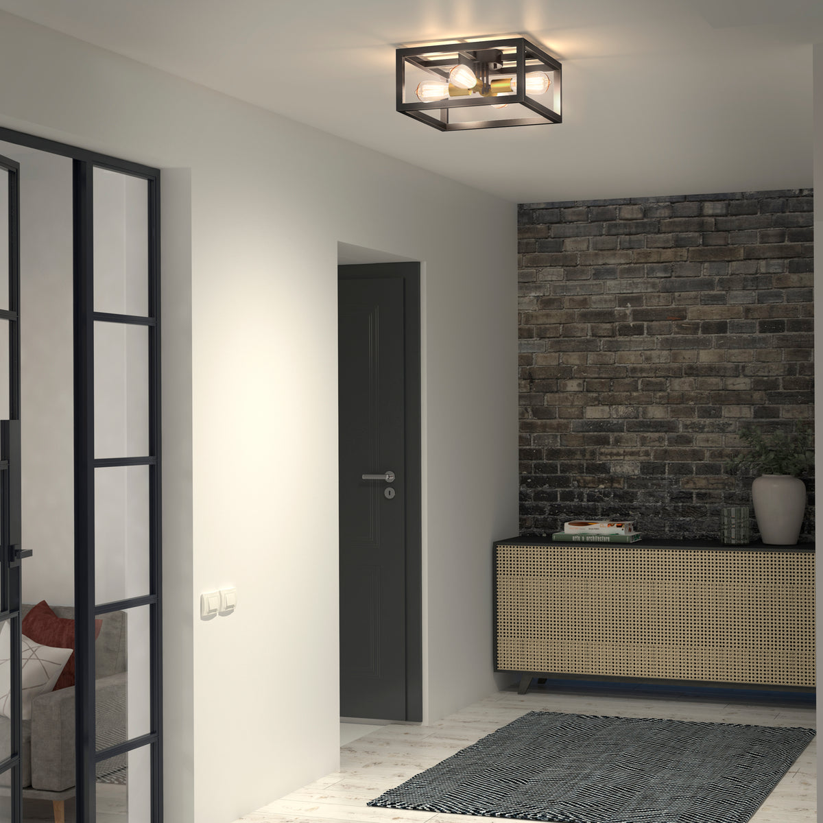 A modern hallway with a black-framed ceiling light, a console table with books and a plant, a textured brick accent wall, a dark door, and a glass-paneled wall revealing part of a sofa and cushions.