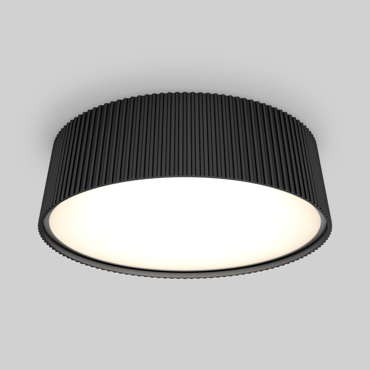 The Artika Groove 13 in. LED modern flush mount light features a black, ribbed exterior and a bright white surface, adding style to any space with its 5 CCT settings, shown installed on a light gray ceiling.