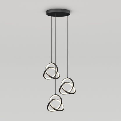 The Artika Zephyr 3-light LED pendant features three black rings with illuminated inner edges, intertwined and suspended from a round black ceiling mount by cords for a modern look.
