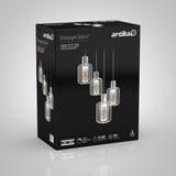 A black box displays the Artika Champagne Globe 4 pendant light fixture, featuring four glass globe lights with bubbles inside, shown suspended at different heights. Product features and LED icons are visible on the packaging.