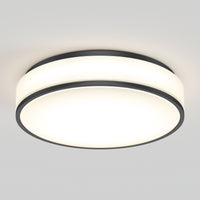 The Artika Giada 15 in. LED modern flush mount light features a sleek round design with a white frosted diffuser and black trim, offering bright, even illumination for any plain white ceiling. Select from 5 CCT options to suit your space.