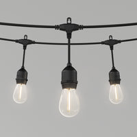 Three vintage-style bulbs hang from the Artika Blaze 20 LED Outdoor Solar String Lights, a sleek black, weather-resistant fixture. Each emits a warm, soft glow—perfect for adding charm to any outdoor area.