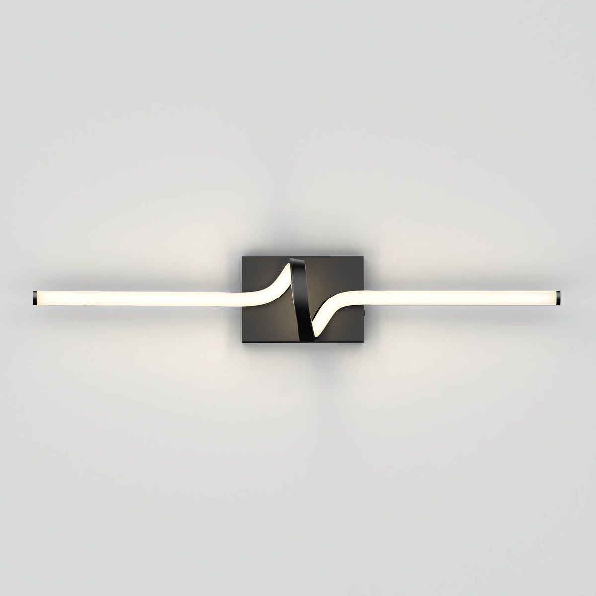 A modern wall sconce with a black square base and a horizontal LED light bar, featuring a wave-like bend in the center, mounted on a plain light gray wall.