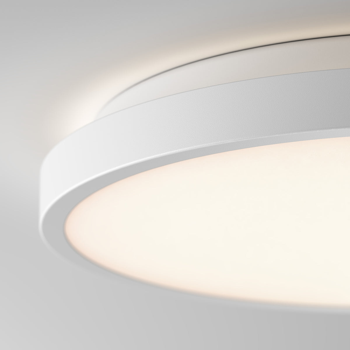 Artika Isara 12 in. RGBIC LED Flush Mount glows softly against a white ceiling with a sleek, modern interchangeable trim design.