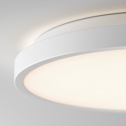 Artika Isara 12 in. RGBIC LED Flush Mount glows softly against a white ceiling with a sleek, modern interchangeable trim design.