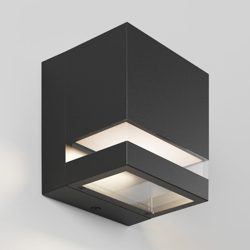 The Artika Valor Square LED wall light casts a soft glow from top and bottom on a white wall.