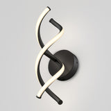 Modern wall sconce with a black circular base and two intertwined, curved light strips—one illuminated and white, the other matte black—mounted against a light gray wall.
