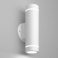 The Artika C7 indoor-outdoor LED wall light 3 CCT is a modern, cylindrical white sconce with a minimalist design that mounts vertically and emits light from both the top and bottom.