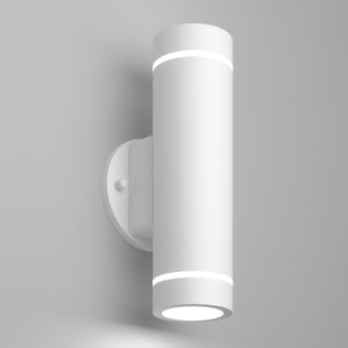The Artika C7 indoor-outdoor LED wall light 3 CCT is a modern, cylindrical white sconce with a minimalist design that mounts vertically and emits light from both the top and bottom.