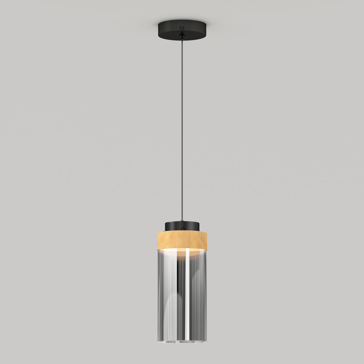 The Artika Hanson 1-light LED pendant 5 CCT features a black ceiling mount, slim black cord, and a cylindrical glass shade with a wooden accent at the top, shown against a plain light gray background.