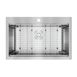 A top-down view of a stainless steel kitchen sink with a drain in the center, a single pre-drilled faucet hole, and a removable metal grid at the bottom.