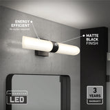 A modern wall-mounted LED light fixture with a matte black finish is installed above a mirror on a gray wall. Text highlights its energy efficiency, matte black finish, integrated LED, and 3-year warranty.