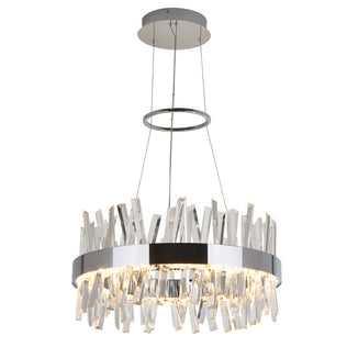 The Enchanted LED pendant light by Artika features a circular chrome frame with vertical, staggered clear crystal prisms that reflect light, suspended by thin cables from a round ceiling mount.