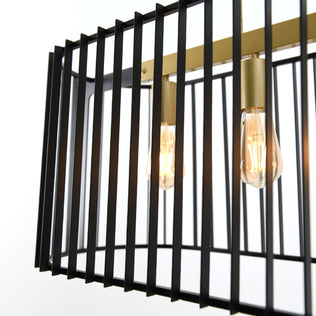 Close-up of the Artika Gatsby LED pendant light, featuring a modern rectangular design with black metal bars, gold accents, exposed Edison-style bulbs, and a brass frame against a plain white background.