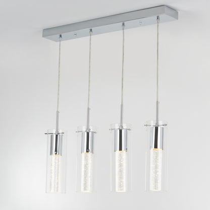 The Artika Bubble Flow 4-light pendant features four cylindrical glass lights with illuminated inner tubes, suspended from a rectangular chrome base against a plain white ceiling.