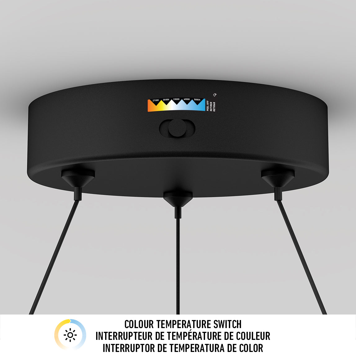 The Artika Bjorn modern LED pendant light 5 CCT features three black suspended cables and a color temperature switch with five options. Below, English and French text reads: Colour temperature switch.