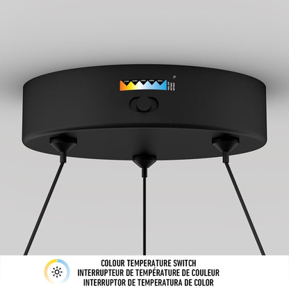 The Artika Bjorn modern LED pendant light 5 CCT features three black suspended cables and a color temperature switch with five options. Below, English and French text reads: Colour temperature switch.
