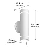 A white cylindrical wall light is shown with dimensions: height 28.9 cm (11.38 in), width 12.3 cm (4.84 in), and depth 12 cm (4.72 in). The fixture is mounted vertically on a round base.