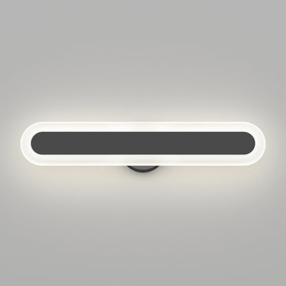 The Artika Pista modern LED bathroom vanity light 5 CCT is a sleek, wall-mounted fixture with an elongated oval design, a black center, and a glowing white border, shown on a plain gray background.