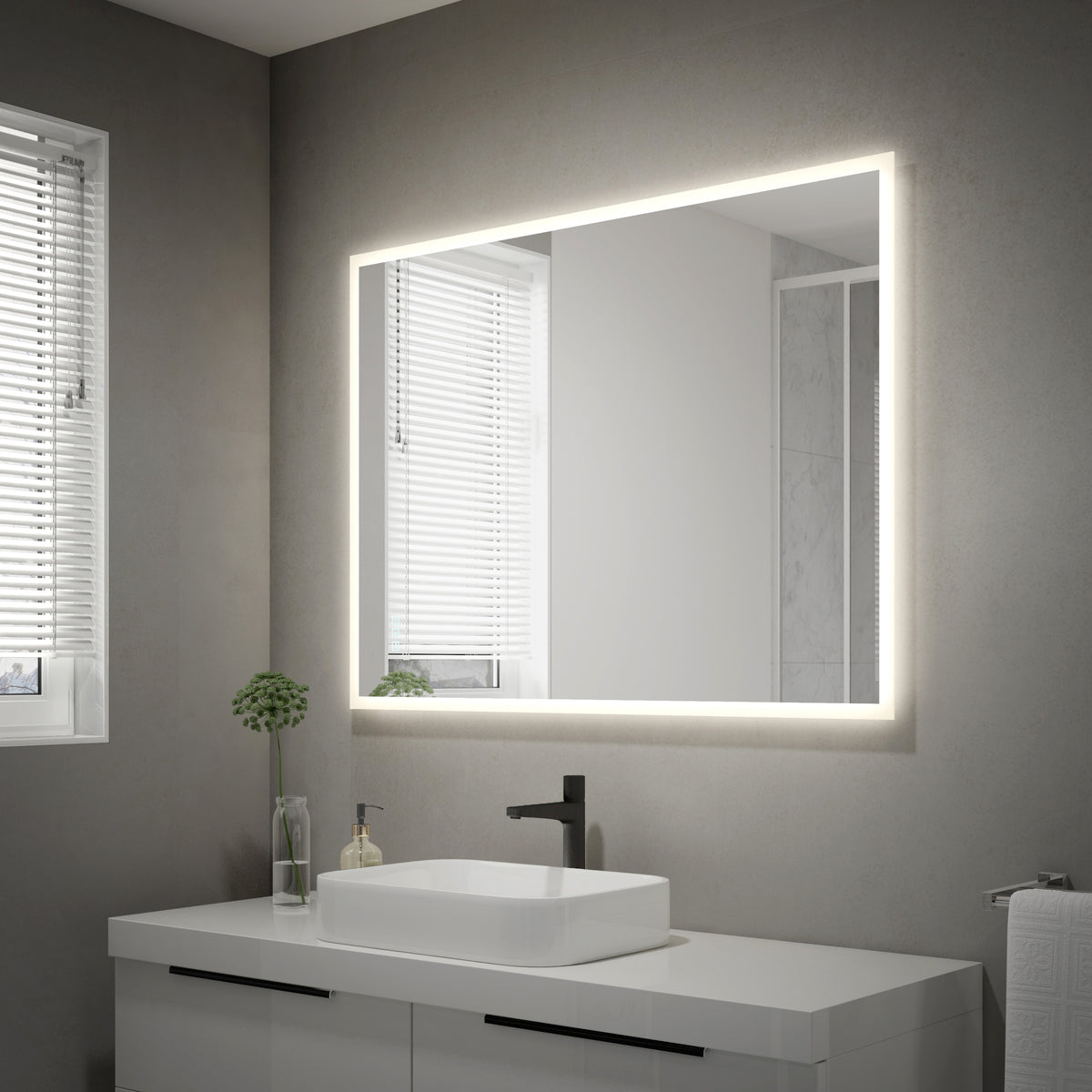 A modern bathroom features gray walls, a white sink with black faucet, a Mavis 48" x 36" Rectangular LED Mirror by Artika above the countertop with drawers, a potted plant, and two windows with white blinds.