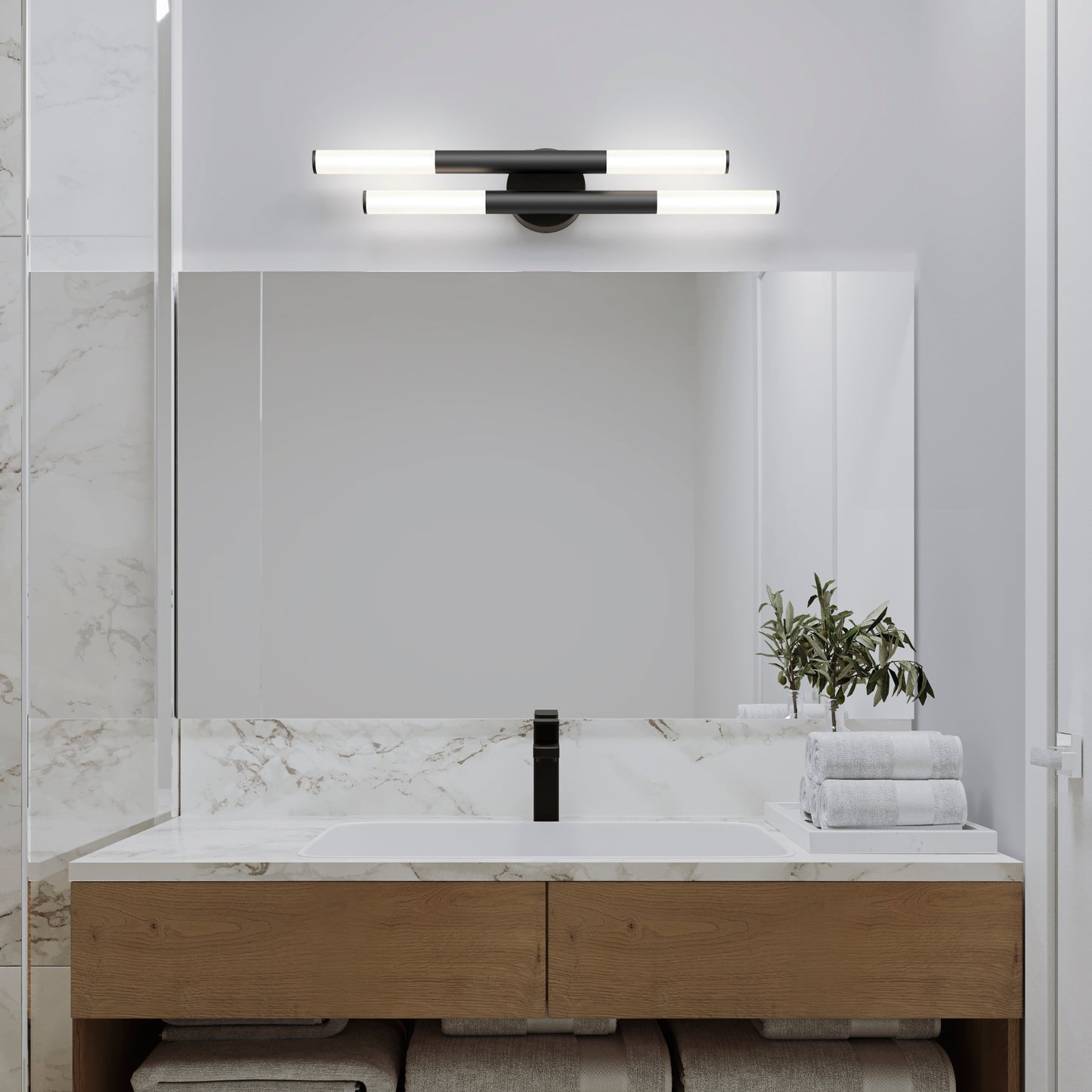 Modern bathroom with a large mirror, wooden vanity, black faucet, stacked white towels, green plant in a vase, and marble accents. Two Artika Boro LED modern bathroom vanity lights (5 CCT) are mounted above the mirror.