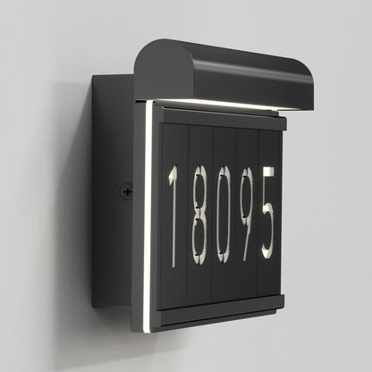 The Artika Bowen modern LED outdoor address wall light displays 18095 with white backlighting on a gray background, providing stylish illuminated house numbers for your exterior.