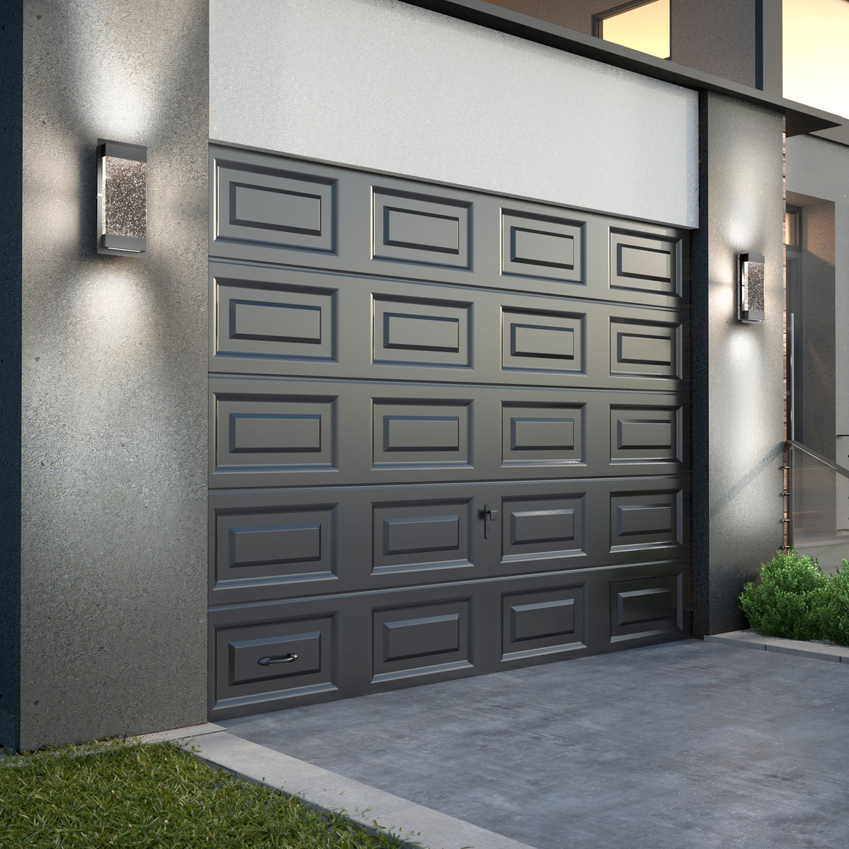 A modern house with a closed dark gray garage door featuring rectangular panels. On either side are Artika Essence Glow Box indoor-outdoor LED wall lights, with steps and green bushes to the right.