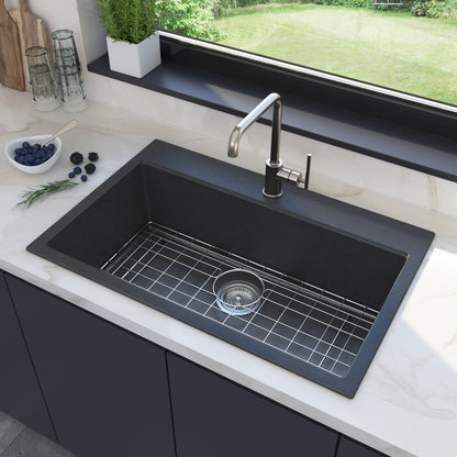 Artika Baycrest 31 in. Modern Sink with metal grid under window; blueberries and rosemary on the white countertop.