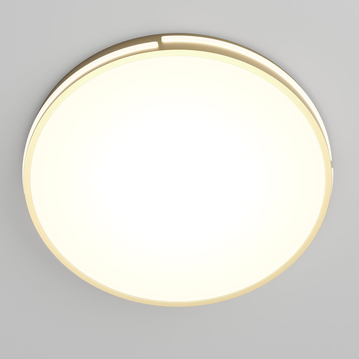 The Artika Delray 15.7 in. LED modern flush mount light features a round design with a golden rim, emitting bright light against a simple, light gray background.