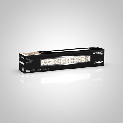 A rectangular black box with Artika branding holds a Glitter LED bathroom vanity light, showcasing an image of the sleek, sparkling fixture on a light gray background.